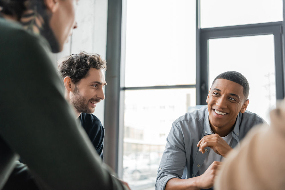 men sharing in group therapy session