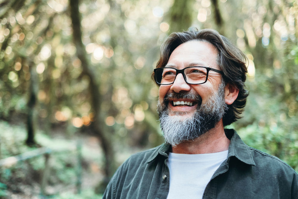 man smiling while outside
