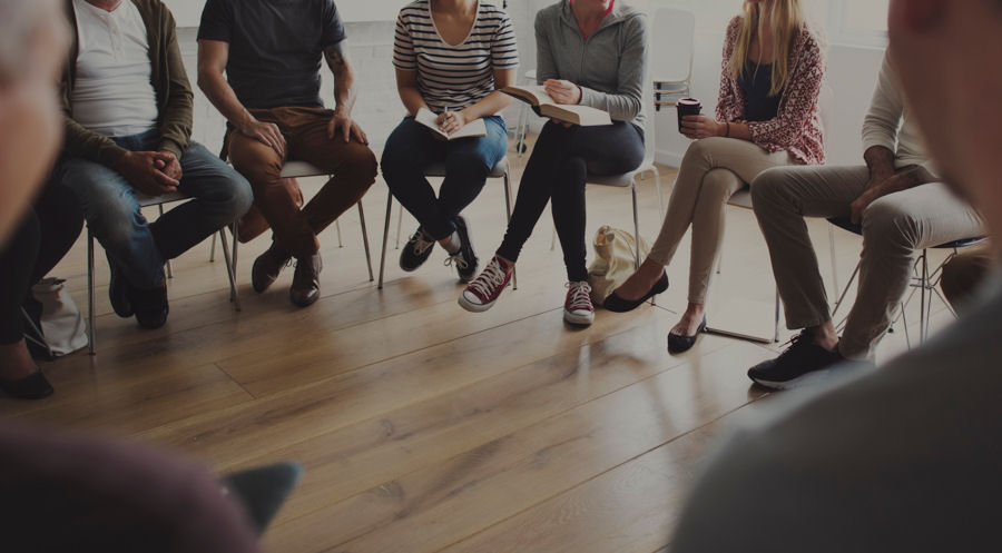 small group discussing addiction treatment
